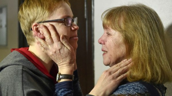 Marina Zolotova (L) with her mother Tatyana after being sentenced at a Minsk court in March