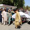 Afghan villagers moving a dead body following an airstrike in Lashkar Gah, Helmand province, in September 2019 that allegedly killed 40 civilians at a wedding celebration.