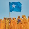 Students wave a Somali flag during a demonstration in support of the government over the controversial deal between Ethiopia and the breakaway region of Somaliland