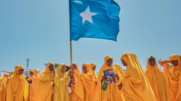 Students wave a Somali flag during a demonstration in support of the government over the controversial deal between Ethiopia and the breakaway region of Somaliland