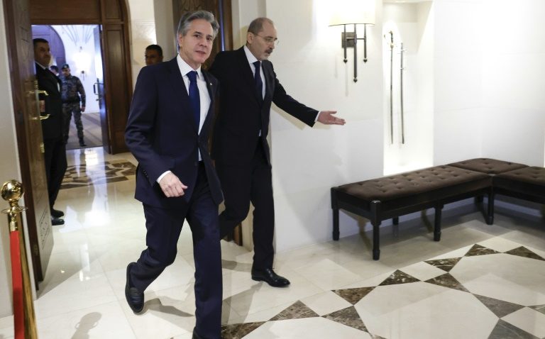 US Secretary of State Antony Blinken (L) is received by Jordanian Foreign Minister Ayman Safadi, as fears of a regional war mount