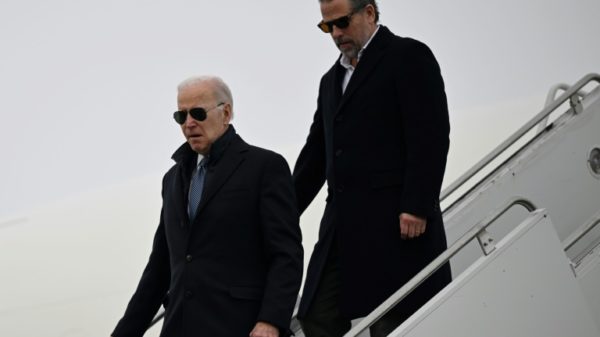 US President Joe Biden, with son Hunter Biden, disembarks from a plane in February 2023