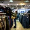 A customer visits a secondhand clothes shop in the Harajuku district of Tokyo