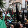 Crowds march in the Beirut funeral procession of Hamas number two Saleh al-Aruri