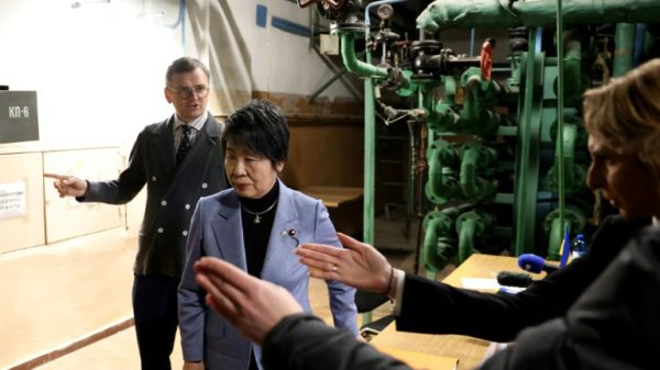 Ukraine's Foreign Minister Dmytro Kuleba, left, and Japan's Foreign Minister Yoko Kamikawa met with journalists at a Kyiv bomb shelter