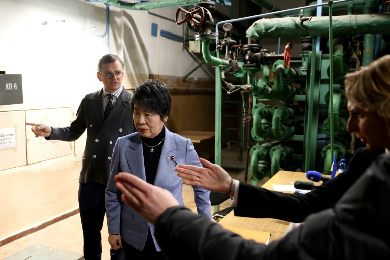 Ukraine's Foreign Minister Dmytro Kuleba, left, and Japan's Foreign Minister Yoko Kamikawa met with journalists at a Kyiv bomb shelter