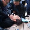 South Korean opposition party leader Lee Jae-myung is attended to after being stabbed in Busan on Tuesday