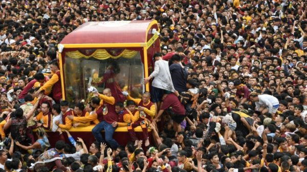 Hundreds of thousands of Catholic faithful swarmed a historic statue of Jesus Christ as it was pulled through the streets of the Philippine capital