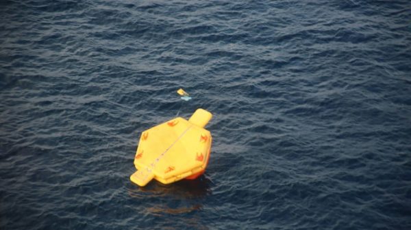 A photo released by Japan's coastguard shows what appears to be an overturned life raft during rescue operations after a US Osprey aircraft crashed into the sea