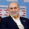 Nine people were charged with conspiracy in a sports memorabilia theft ring that took items from the museums of such legends as the late Yogi Berra, shown at a Baseball Hall of Fame ceremony in 2012