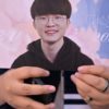 A fans shows off memorabilia of South Korea’s eSports player Lee Sang-hyeok, also known as Faker