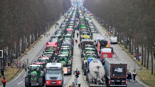 The protesters blocked one of the main roads through central Berlin near the Brandenburg Gate, dumping manure on the road