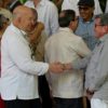 Chief Negotiator of the Government of Colombia Jose Otty Patino (L) and Colombia's National Liberation Army (ELN) guerrilla commander Pablo Beltran shake hands during peace talks in Havana