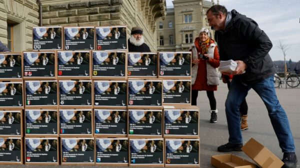 Swiss Animal Alliance activists piled up boxes at the handover of signatures to trigger a popular vote on banning fur and foie gras imports