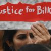 The case has sparked protests since the 11 convicts were released two years ago: in this August 2022 photograph a woman holds a placard in Mumbai demanding justice for Bilkis Bano