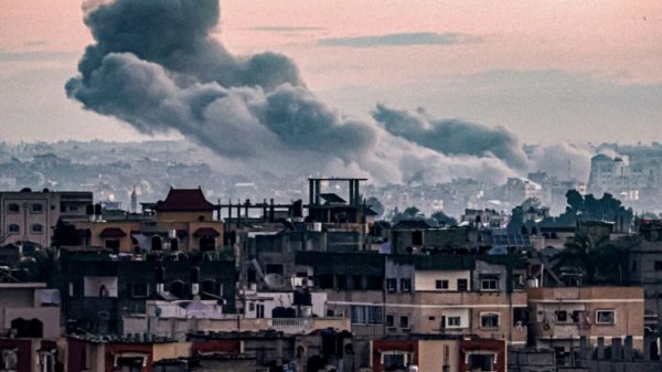 Smoke billows during Israeli bombardment on Khan Yunis from Rafah in the southern Gaza Strip early on January 3, 2024