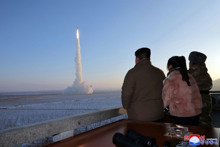 North Korean leader Kim Jong Un (L), seen watching a test launch of his country's largest ICBM, has urged his party to 'accelerate' war preparations