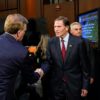 US Senator Richard Blumenthal shakes hands with Chief Operating Officer of the PGA Tour Ron Price during a Senate subcommittee hearing examining the business deal between the PGA Tour and the Public Investment Fund of Saudi Arabia, backers of LIV Golf