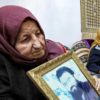 Hamas number two Saleh al-Aruri's mother Aisha clutches a photograph of of her slain son at the family home in Arura, in the Israeli-occupied West Bank