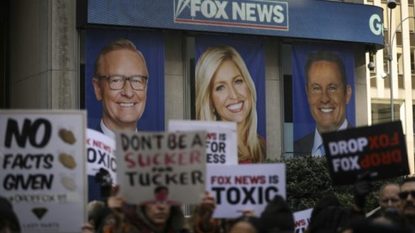 Protestors outside Fox News, which is being sued for $1.6 billion by Dominion Voting Systems