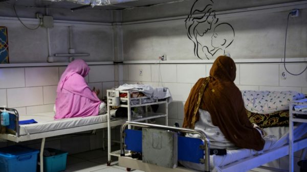 Afghan women sit beside their newborns at the Doctors Without Borders (MSF)-run maternity hospital in Khost