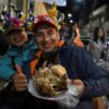 Customers brave the cold to queue up for their traditional sheep's head dish in Oruro