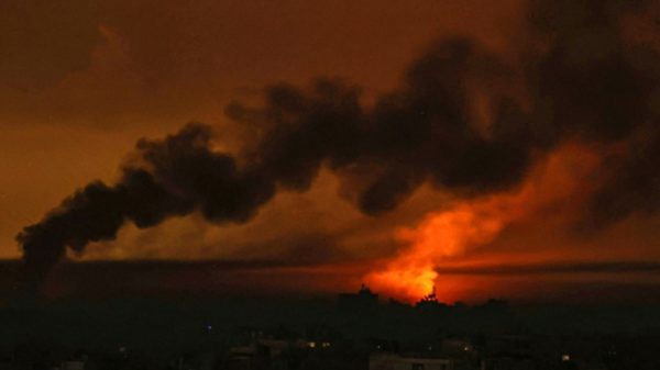 Smoke billowing over Khan Yunis in the southern Gaza Strip during Israeli bombardment