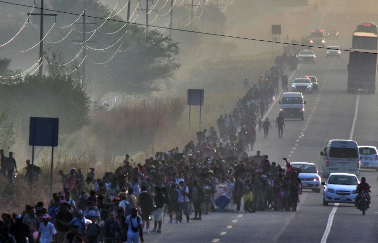 US-bound migrants walk in a caravan in Mexico's southern state of Chiapas on January 8, 2024