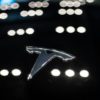 A Tesla logo is seen on a car at a dealership in Beijing