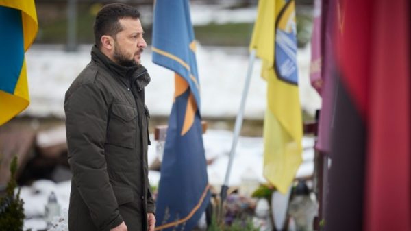 Ukrainian President Volodymyr Zelensky pays his respects at the graves of Ukrainian soldiers in Lviv