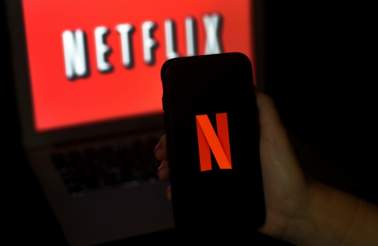 Netflix says its new ad-subsidized subscription tier is starting out better than expected, and that it will begin a broad rollout of paid plans for people who share passwords with other households