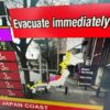 A video image taken in Hong Kong shows a warning message from a live feed on NHK World asking people to evacuate after a series of major earthquakes in central Japan prompted tsunami warnings