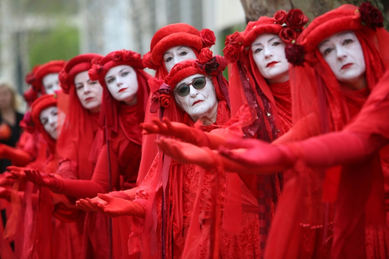 Members of performance troupe Red Rebel Brigade march in London at the Extinction Rebellion demonstration