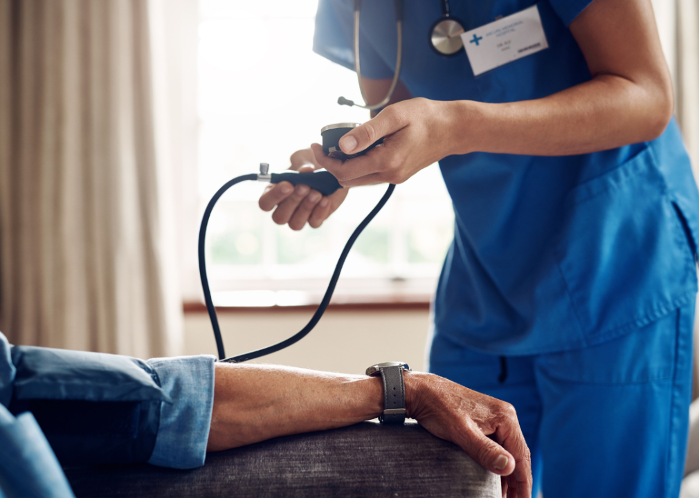 A medical professional taking a patient's vitals.